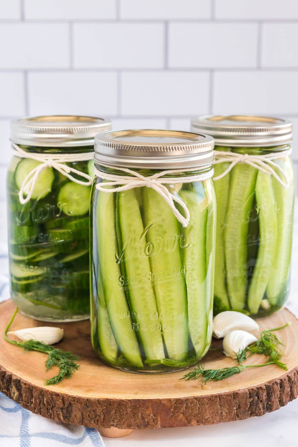 cucumber slices placed in jar with pickling juice