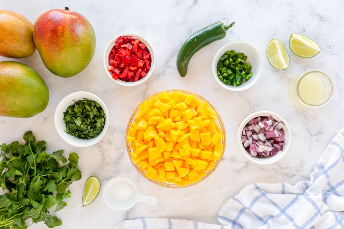 mango salsa ingredients in small serving bowls